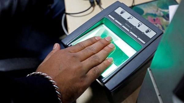 <div class="paragraphs"><p>A woman goes through the process of finger scanning for the Unique Identification (UID) database system Aadhaar.&nbsp;</p></div>