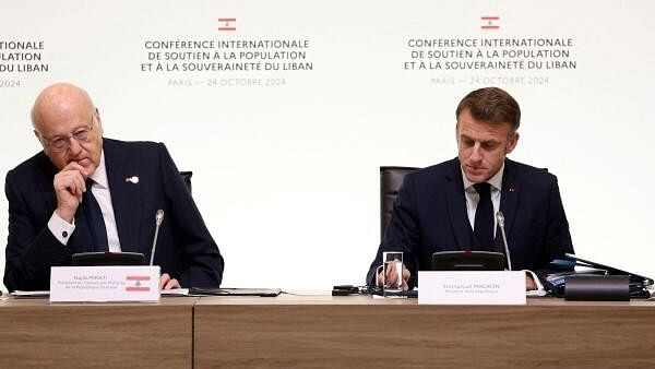 <div class="paragraphs"><p>Lebanon's Prime Minister Najib Mikati (Left) and France's President Emmanuel Macron (Right) look on during an international press conference in support of Lebanon, in Paris, France on October 24, 2024. </p></div>