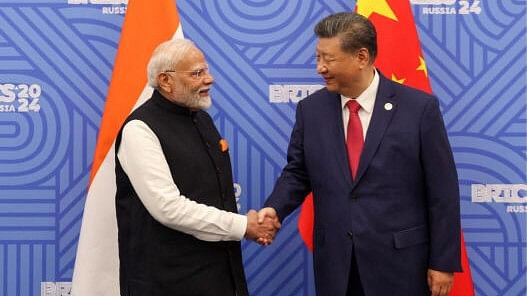 <div class="paragraphs"><p>Indian Prime Minister Narendra Modi shakes hands with Chinese President Xi Jinping before their meeting on the sidelines of the BRICS summit in Kazan, Russia</p></div>