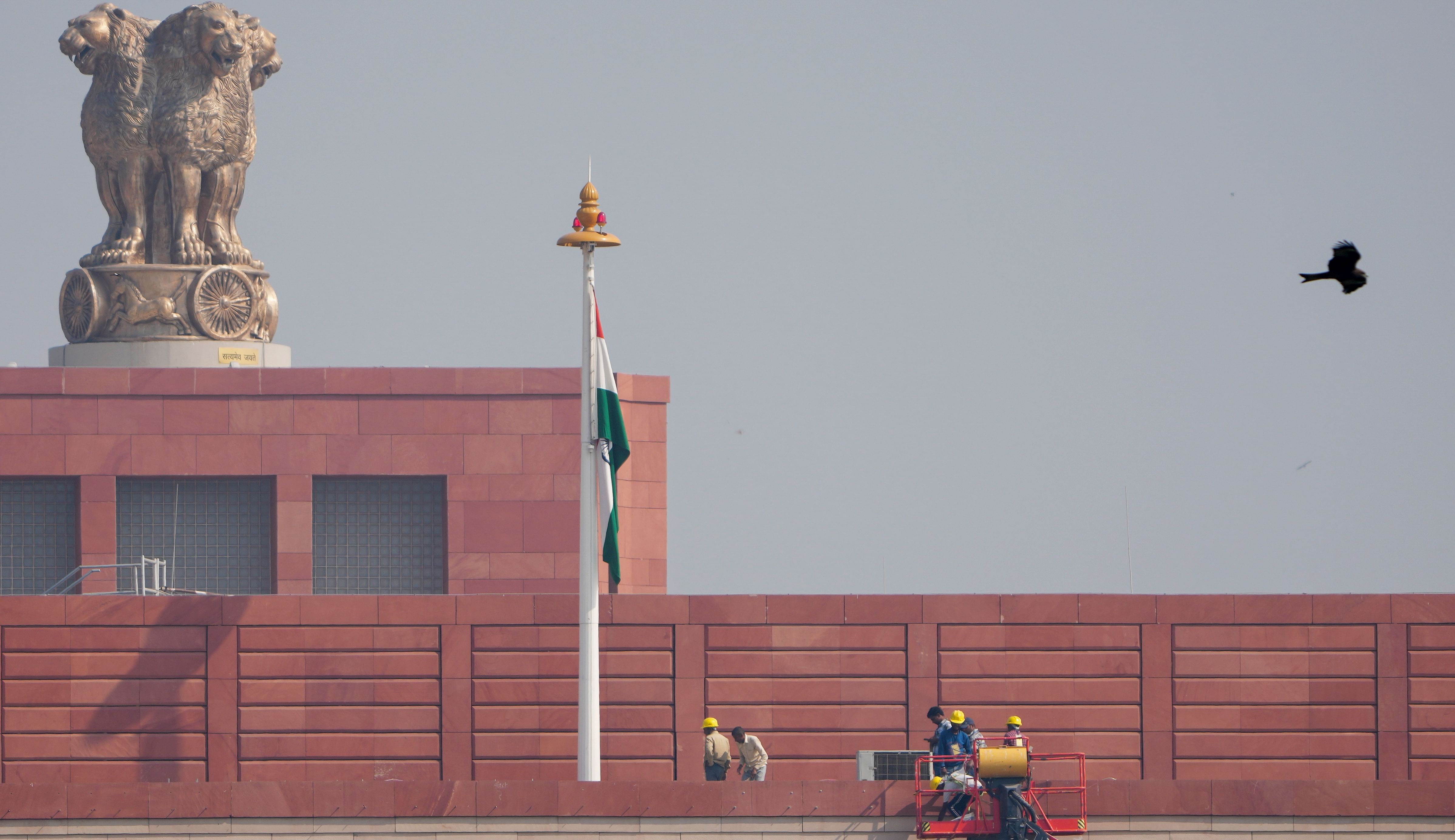 <div class="paragraphs"><p>Officials at work atop the Parliament House complex in New Delhi, Thursday, Oct. 24, 2024. </p></div>