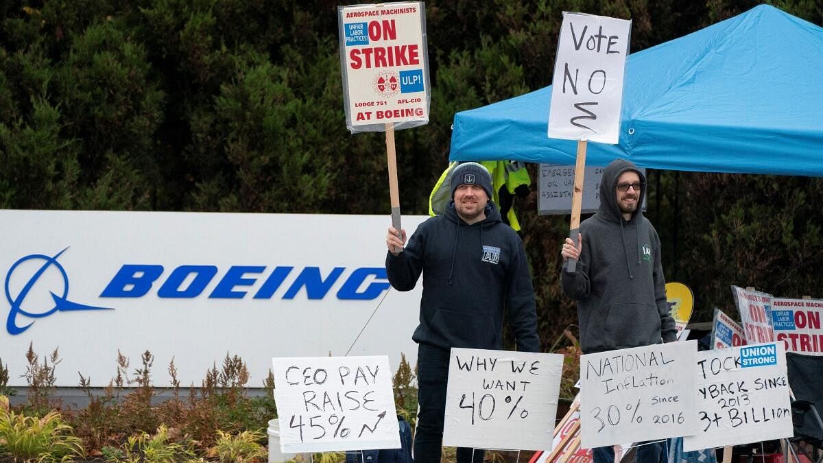 <div class="paragraphs"><p>Boeing workers from the International Association of Machinists and Aerospace Workers District 751 gather on a picket line near the entrance to a Boeing production facility on the day of a vote on a new contract proposal during an ongoing strike in Renton, Washington, US, October 23, 2024.</p></div>