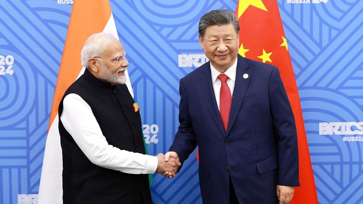 <div class="paragraphs"><p>PM Narendra Modi shakes hands with Chinese President Xi Jinping on the sidelines of the BRICS summit in Kazan.</p></div>