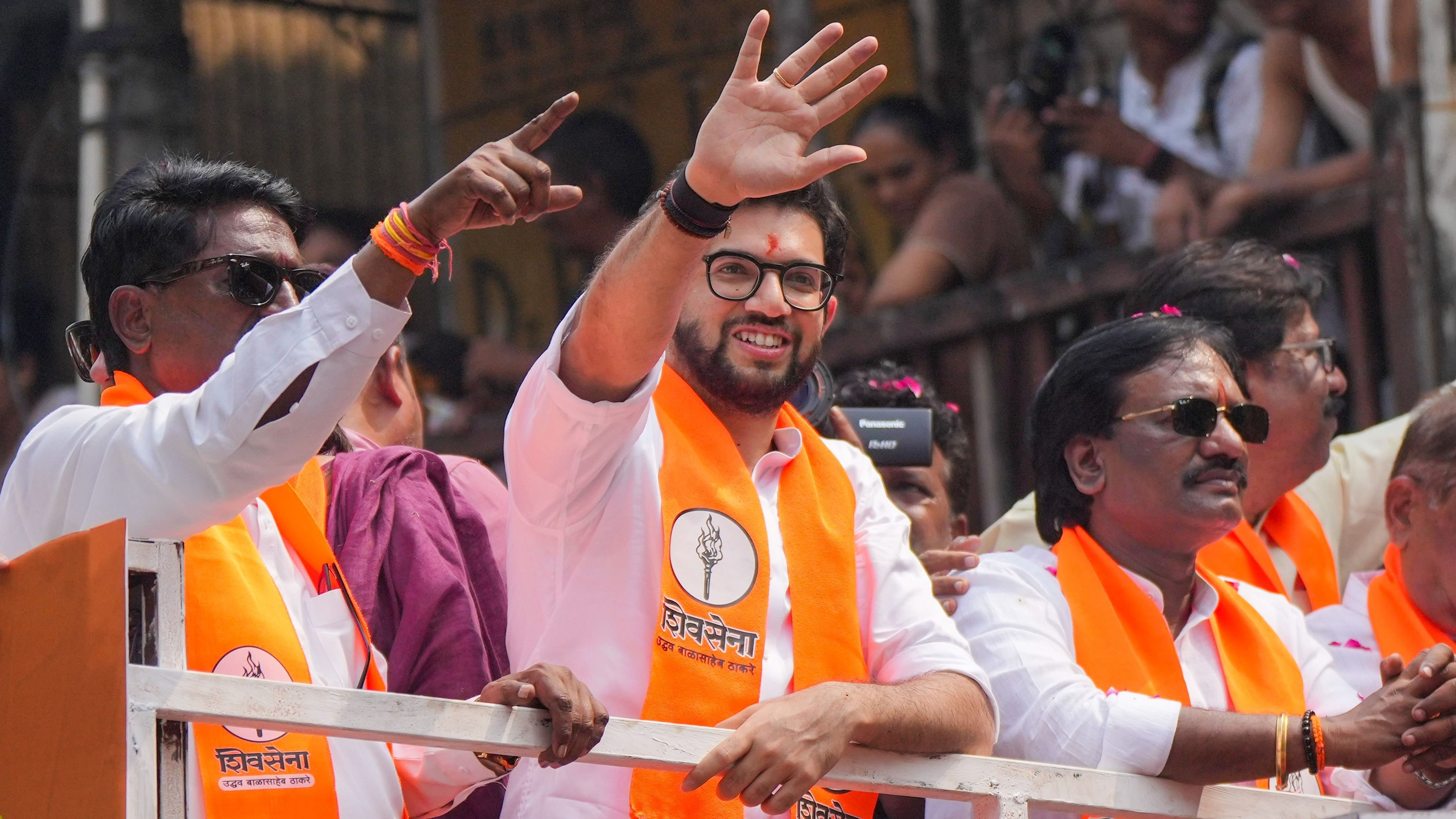 <div class="paragraphs"><p>Shiv Sena (UBT) leader and Yuva Sena chief Aaditya Thackeray with others waves to supporters during a his nomination rally for the upcoming Maharashtra Assembly elections, in Mumbai, Thursday.</p></div>