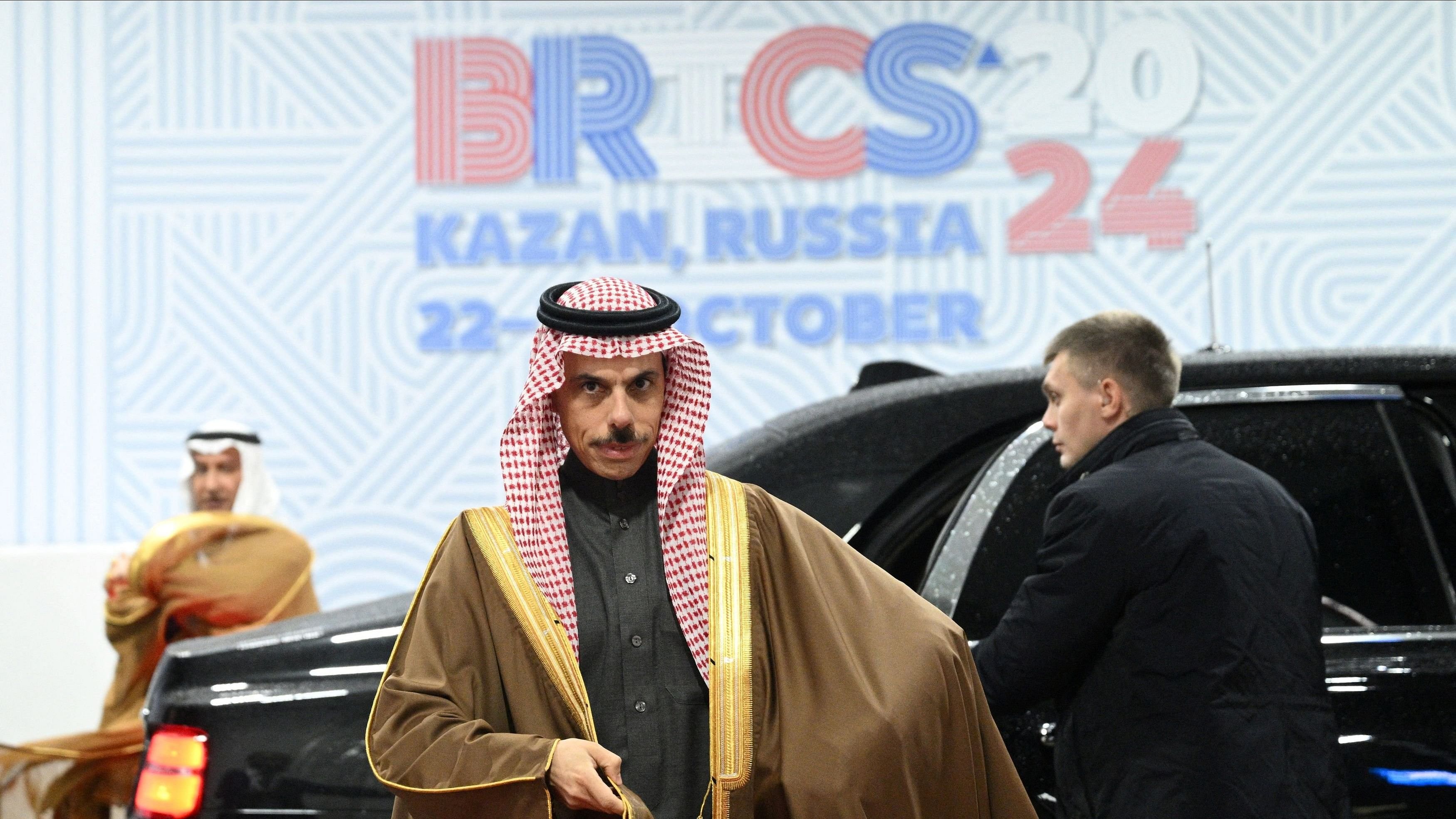 <div class="paragraphs"><p>Saudi Foreign Minister Faisal bin Farhan walks out of a car as he attends the BRICS summit in Kazan, Russia.</p></div>