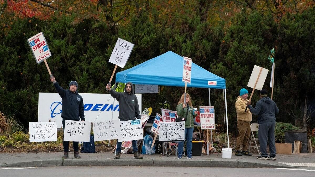 <div class="paragraphs"><p>Boeing workers from the International Association of Machinists and Aerospace Workers District 751 gather on a picket line near the entrance to a Boeing production facility.</p></div>