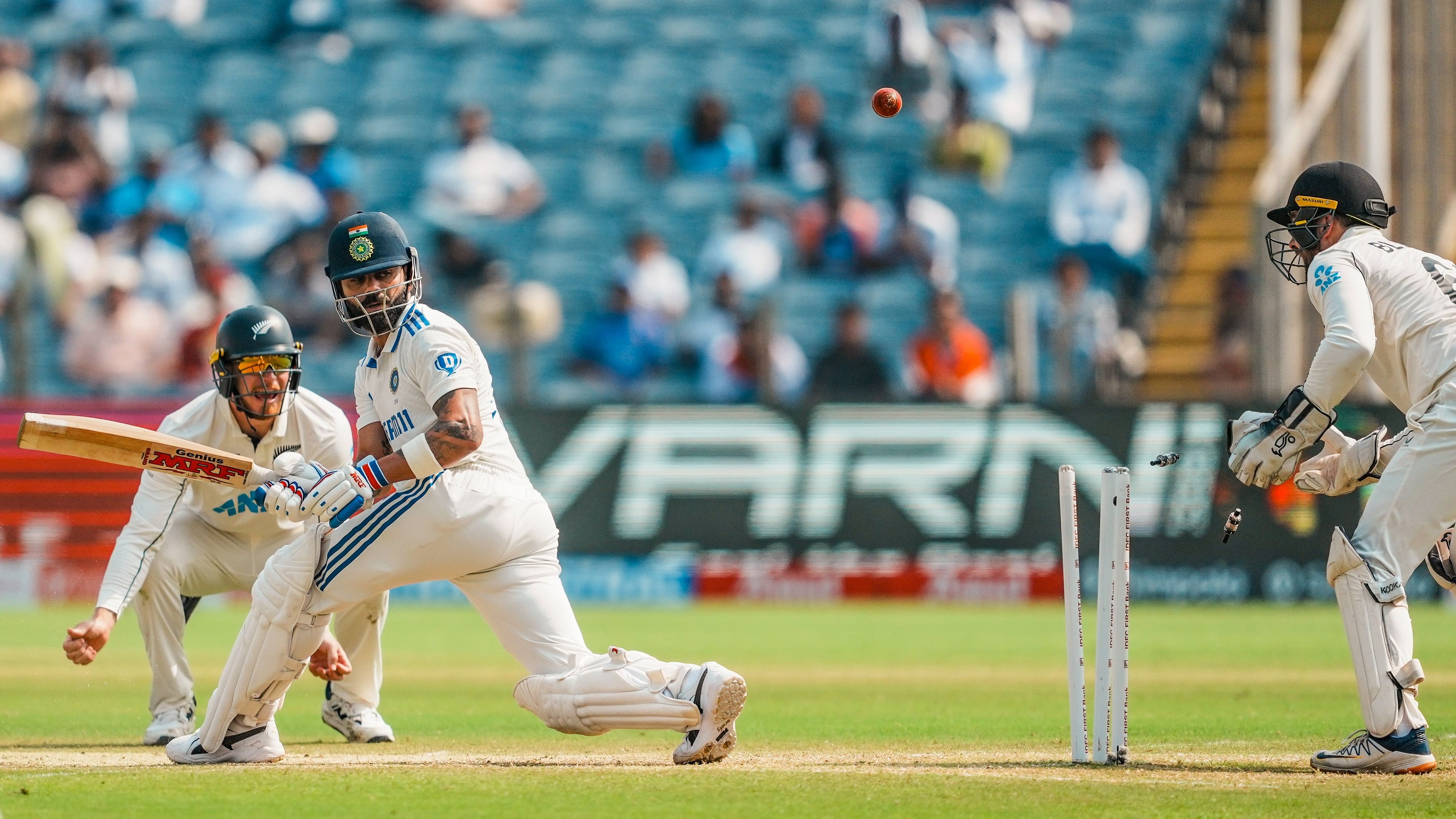 <div class="paragraphs"><p>Virat Kohli being bowled by New Zealand's Mitchell Santner on the second day of the second test cricket match between India and New Zealand, at the Maharashtra Cricket Association Stadium, in Pune.</p></div>