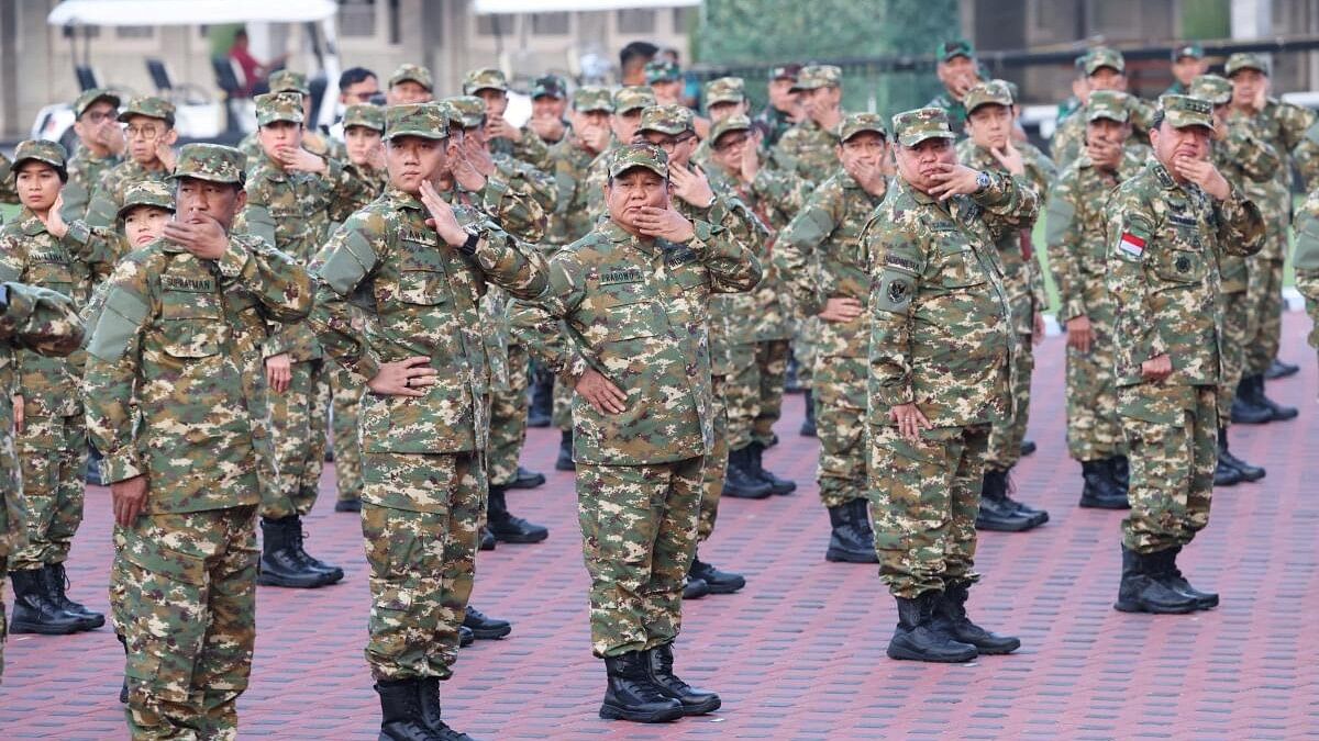 <div class="paragraphs"><p>Indonesia's President Prabowo Subianto attends a warmup session during the retreat with newly appointed cabinet ministers at a military academy in Magelang, Central Java province, Indonesia, October 25, 2024</p></div>