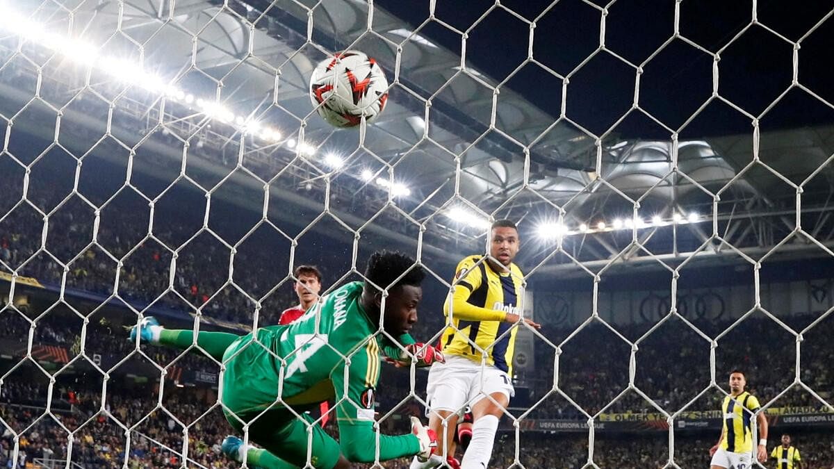 <div class="paragraphs"><p>Fenerbahce's Youssef En-Nesyri scores their first goal past Manchester United's Andre Onana.</p></div>