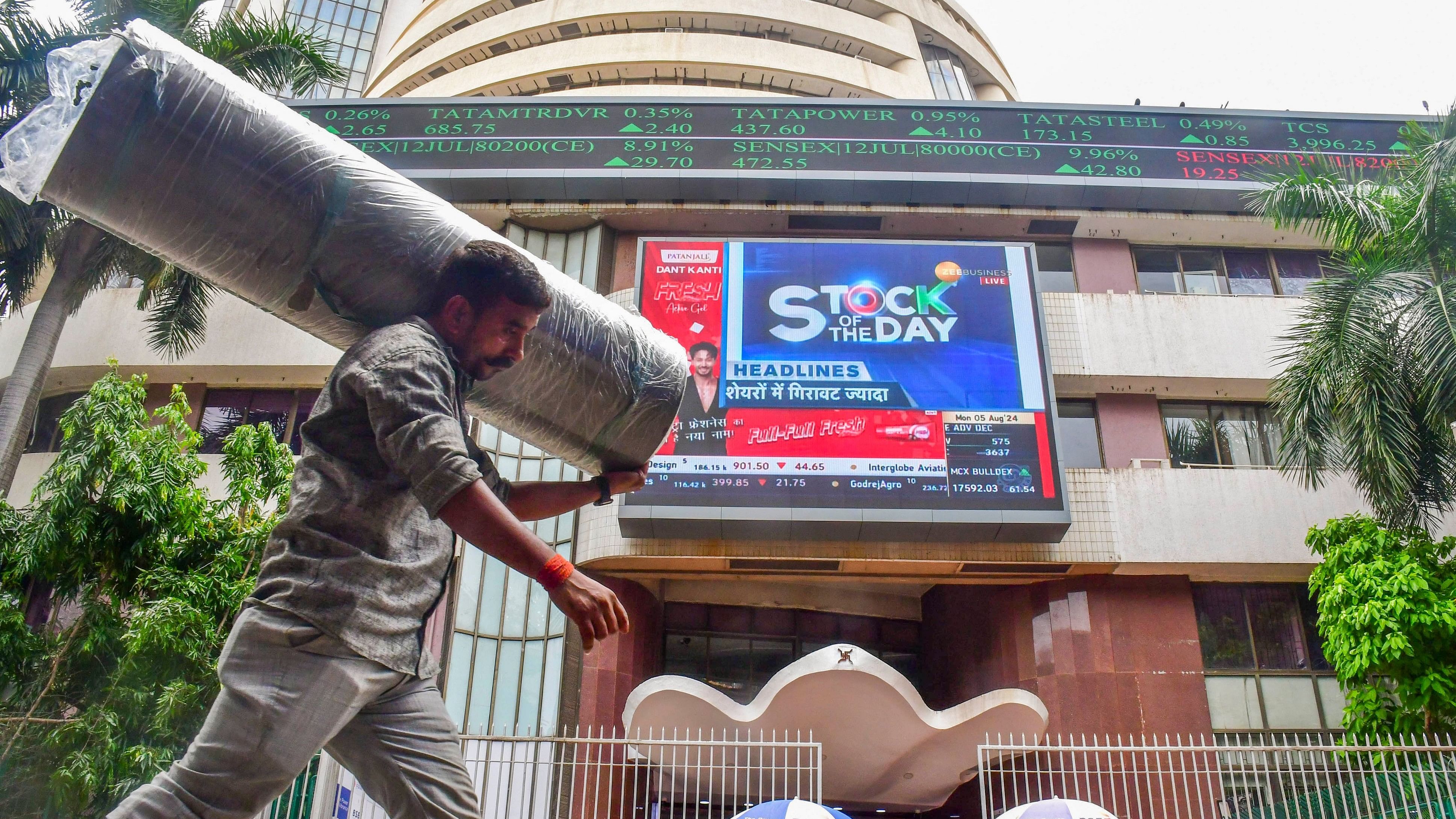 <div class="paragraphs"><p>People walk past the Bombay Stock Exchange.</p></div>