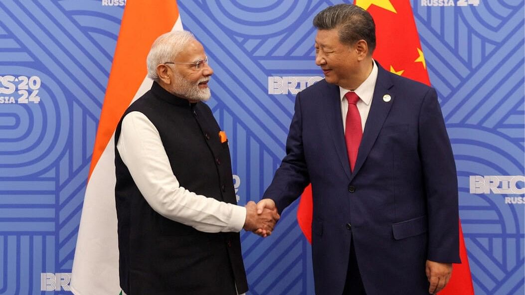 <div class="paragraphs"><p>Prime Minister Narendra Modi shakes hands with Chinese President Xi Jinping before their meeting on the sidelines of the BRICS summit in Kazan, Russia, October 23, 2024. </p></div>