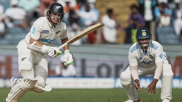 <div class="paragraphs"><p>New Zealand's captain Tom Latham plays a shot on the leg side during the second day of the Pune cricket Test against India on Friday.</p></div>