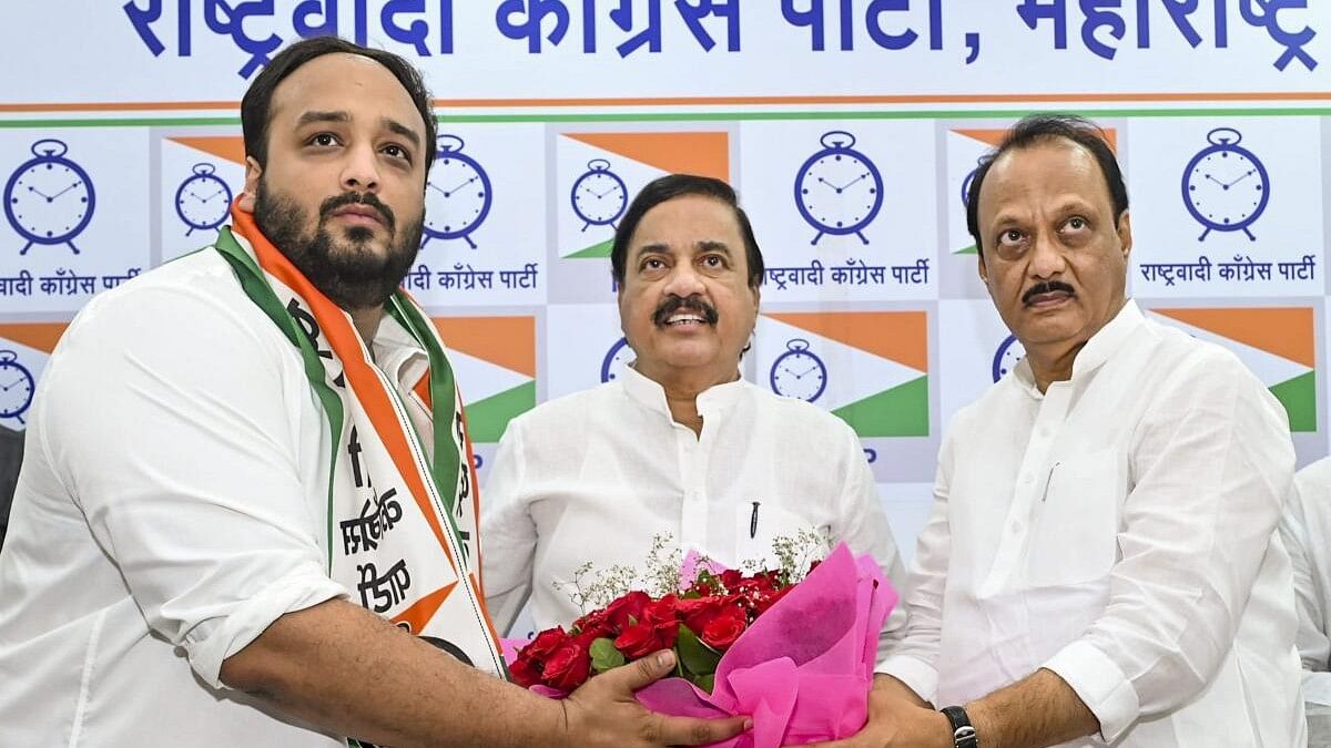 <div class="paragraphs"><p>Maharashtra Deputy Chief Minister and NCP (Ajit) chief Ajit Pawar felicitates Zeeshan Siddique as the latter joins the party and will contest from the Bandra East constituency in the upcoming Maharashtra Assembly elections, in Mumbai, Friday, October 25, 2024.</p></div>