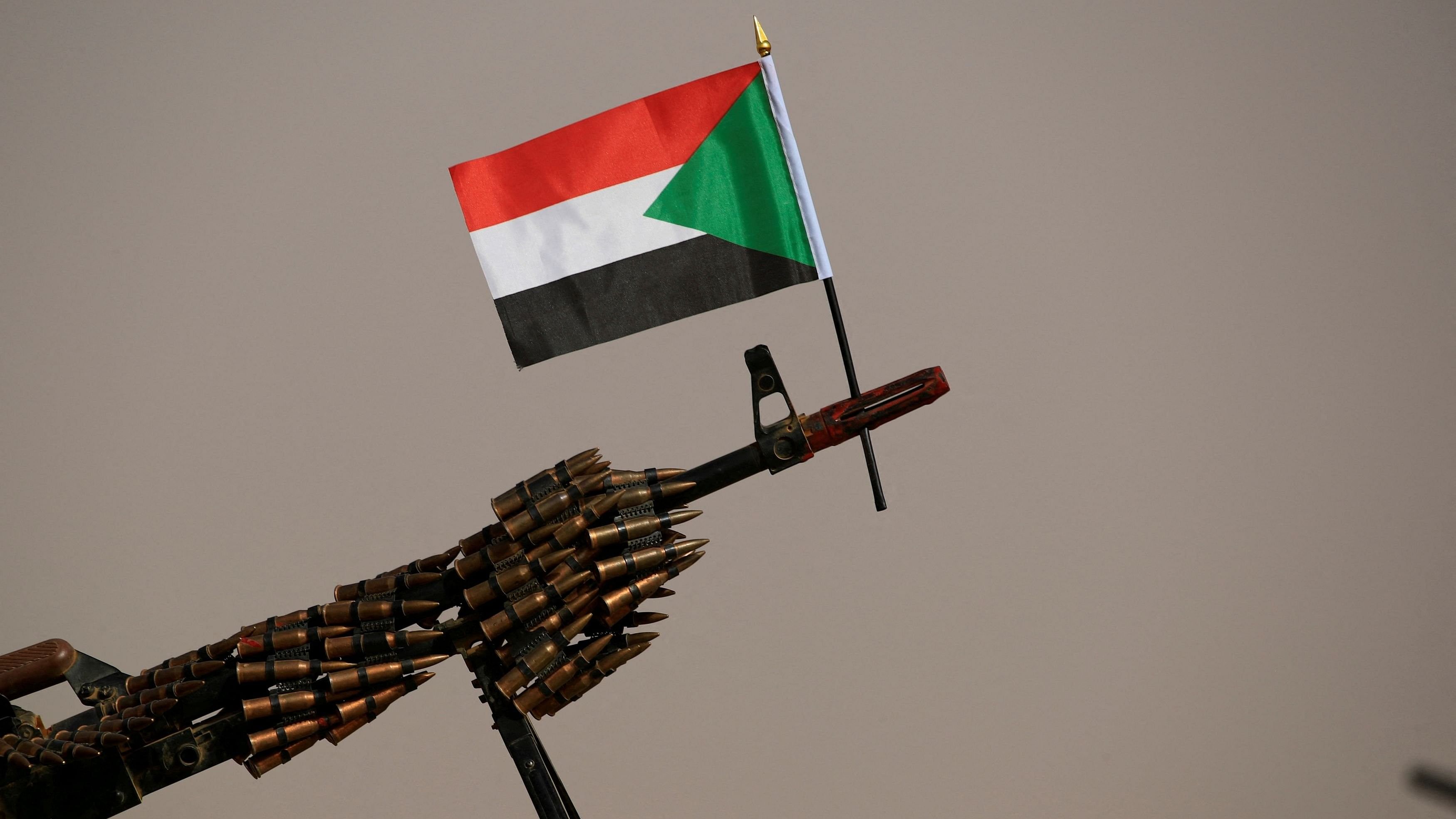 <div class="paragraphs"><p>A Sudanese national flag is attached to a machine gun of Paramilitary Rapid Support Forces  soldiers.</p></div>