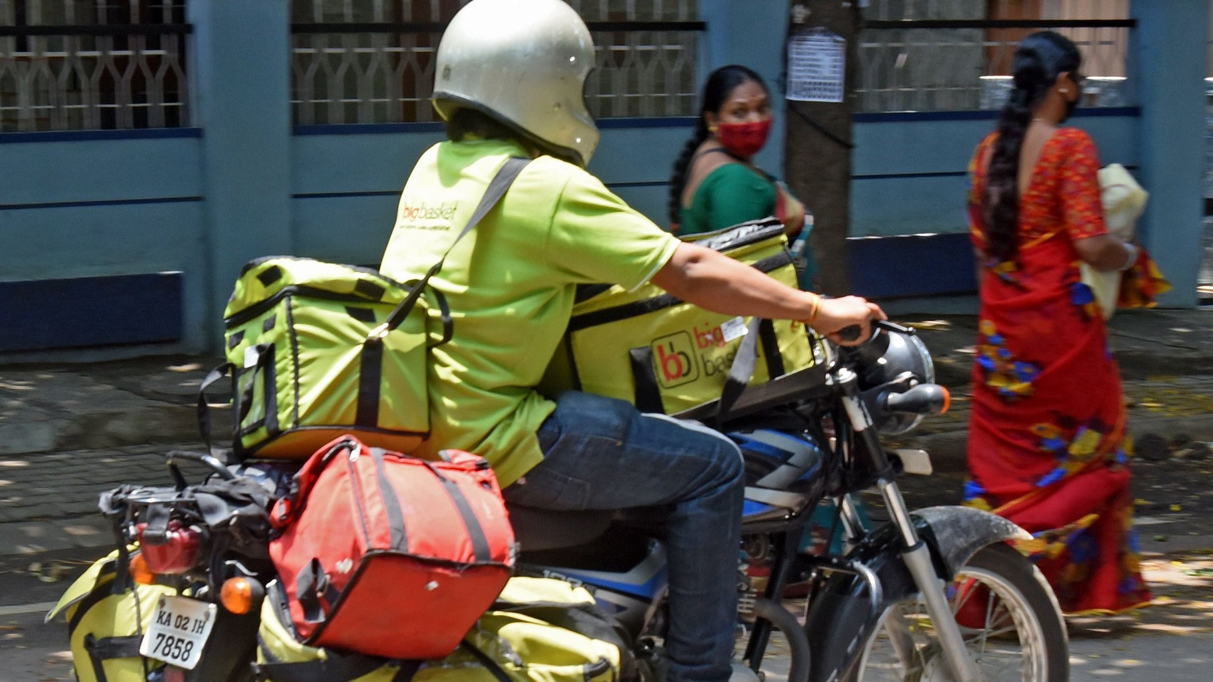 <div class="paragraphs"><p>The market size of quick commerce apps is estimated to be valued at Rs 50,461 cr. In pic, a person delivers groceries for a q-commerce platform. </p></div>