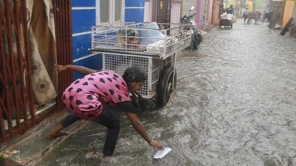 <div class="paragraphs"><p>A girl plays during rain which impacted regions in Tamil Nadu.</p></div>