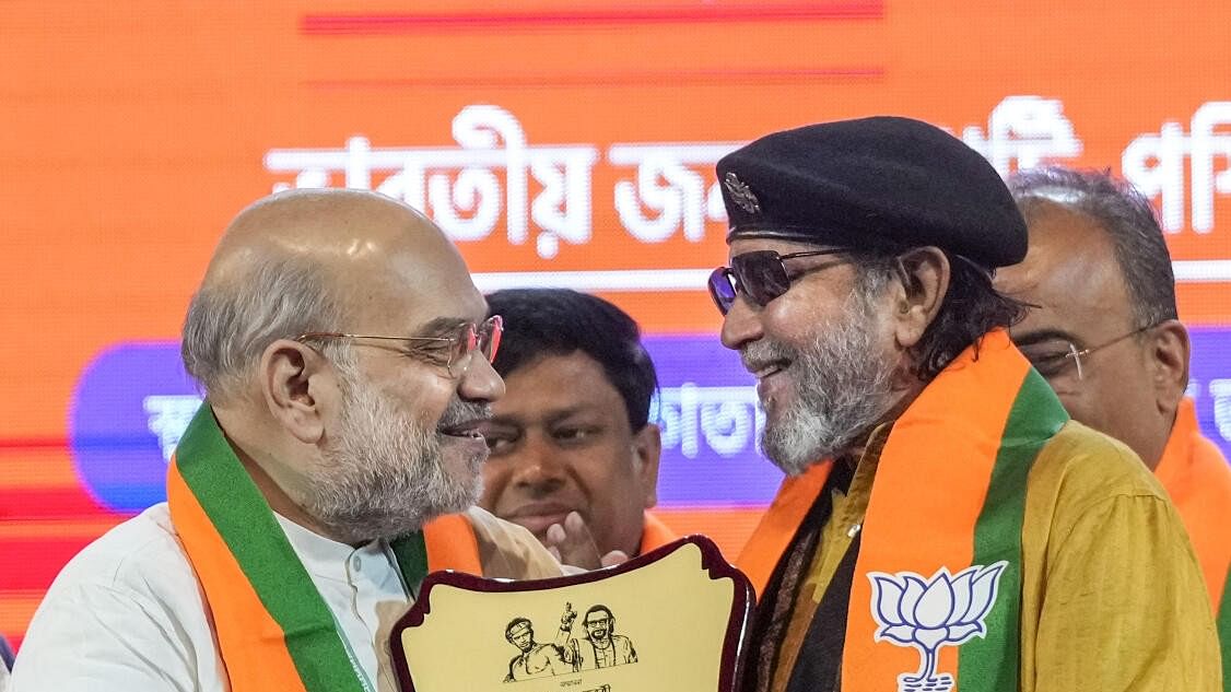 <div class="paragraphs"><p>Union Home Minister Amit Shah with party leader Mithun Chakraborty at the BJP's membership drive, in Kolkata.</p></div>