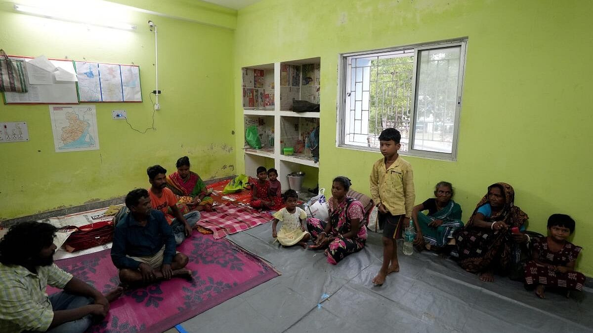 <div class="paragraphs"><p>Locals at a relief camp at Digha after the landfall of Cyclone ‘Dana’. </p></div>