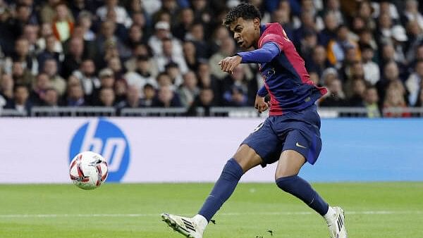 <div class="paragraphs"><p>Barcelona's Lamine Yamal scores a goal&nbsp;during Saturday's match at the Santiago Bernabeu in Madrid, Spain on October 26</p></div>