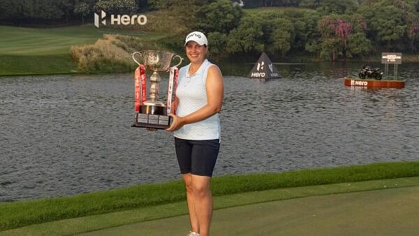 <div class="paragraphs"><p>England’s Liz Young poses with her Hero Women’s Indian Open trophy at the DLF Golf and Country Club on Sunday. </p></div>