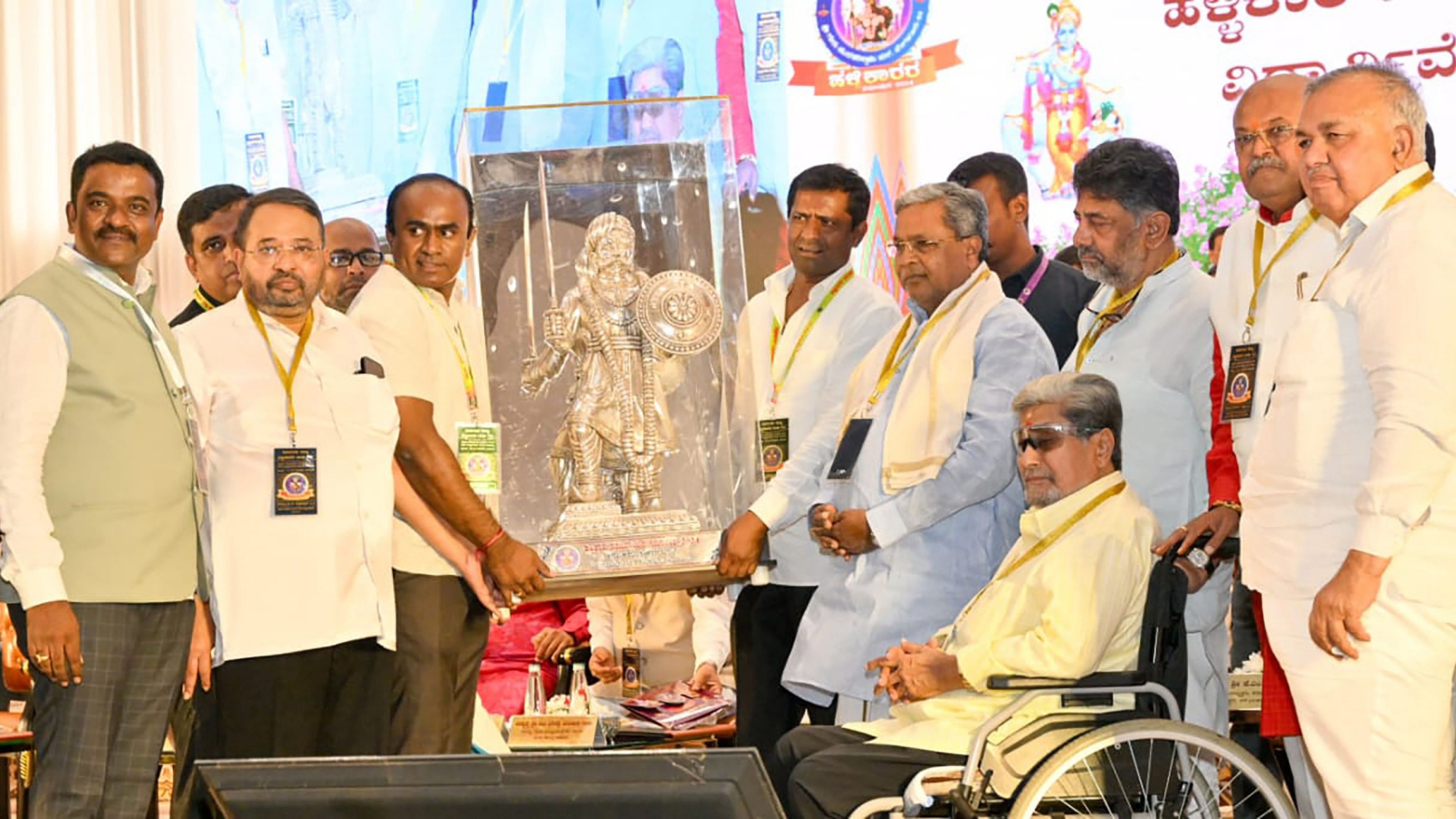 Chief Minister Siddaramaiah, his deputy D K Shivakumar and other Congress leaders during a conference of the Hallikar community on Sunday.