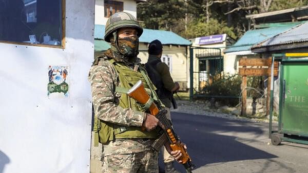 <div class="paragraphs"><p>Security personnel stand guard in J&amp;K</p></div>