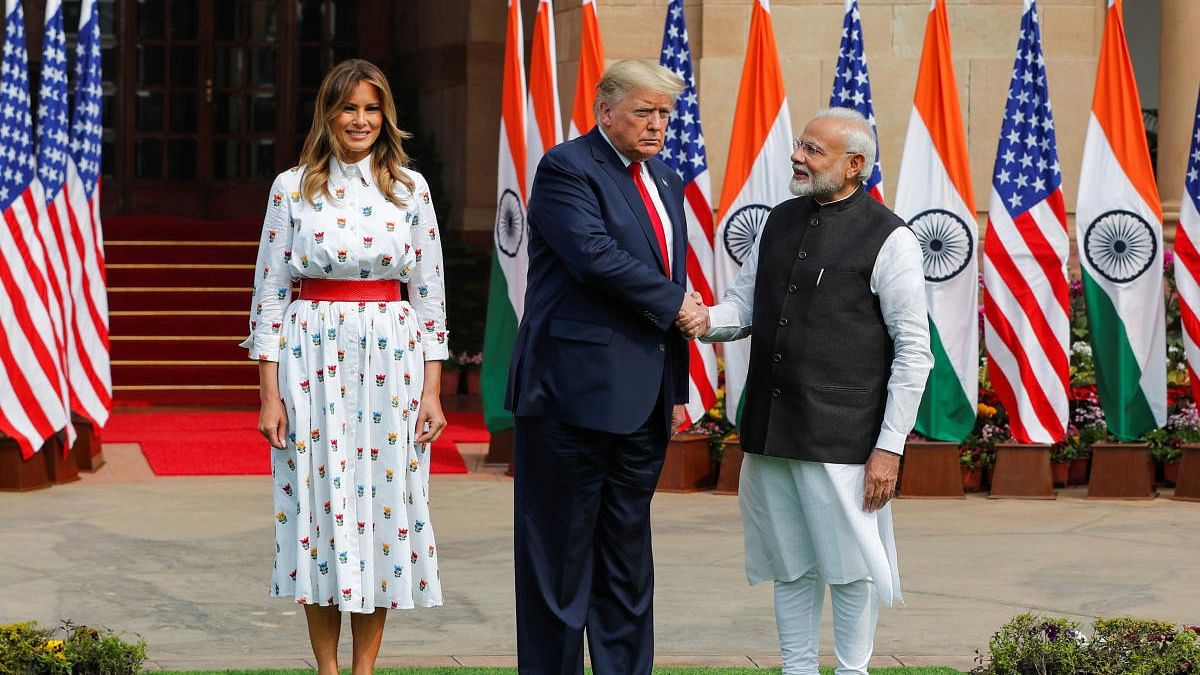 <div class="paragraphs"><p>Former US President Donald Trump shakes hands with India's Prime Minister Narendra Modi during his 2020 visit. Also seen in the picture is former First Lady Melania Trump.</p></div>