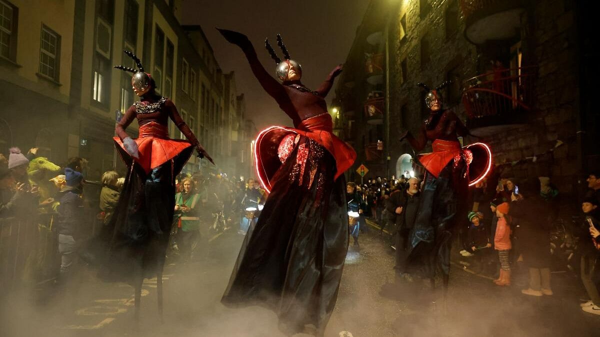 <div class="paragraphs"><p>Performers with street performance group Macnas dance during their Halloween parade called 'Alf's Journey' inspired by climate change and habitat loss, in Galway, Ireland.</p></div>