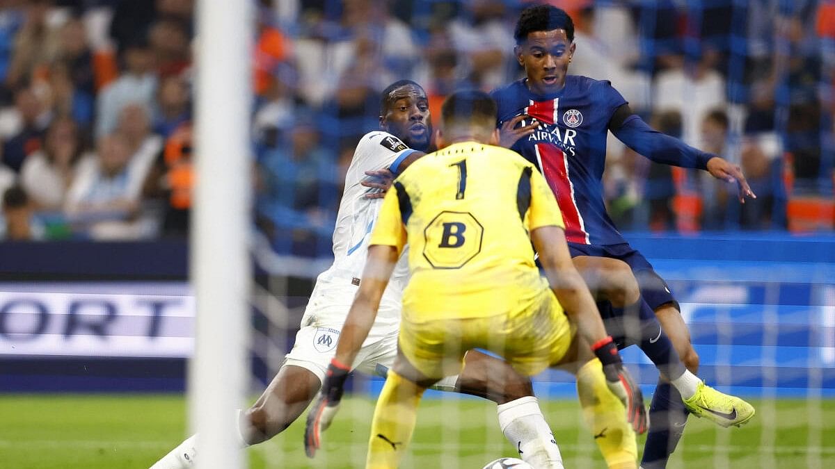 <div class="paragraphs"><p>Olympique de Marseille's Geoffrey Kondogbia and Geronimo Rulli in action with Paris St Germain's Senny Mayulu</p></div>