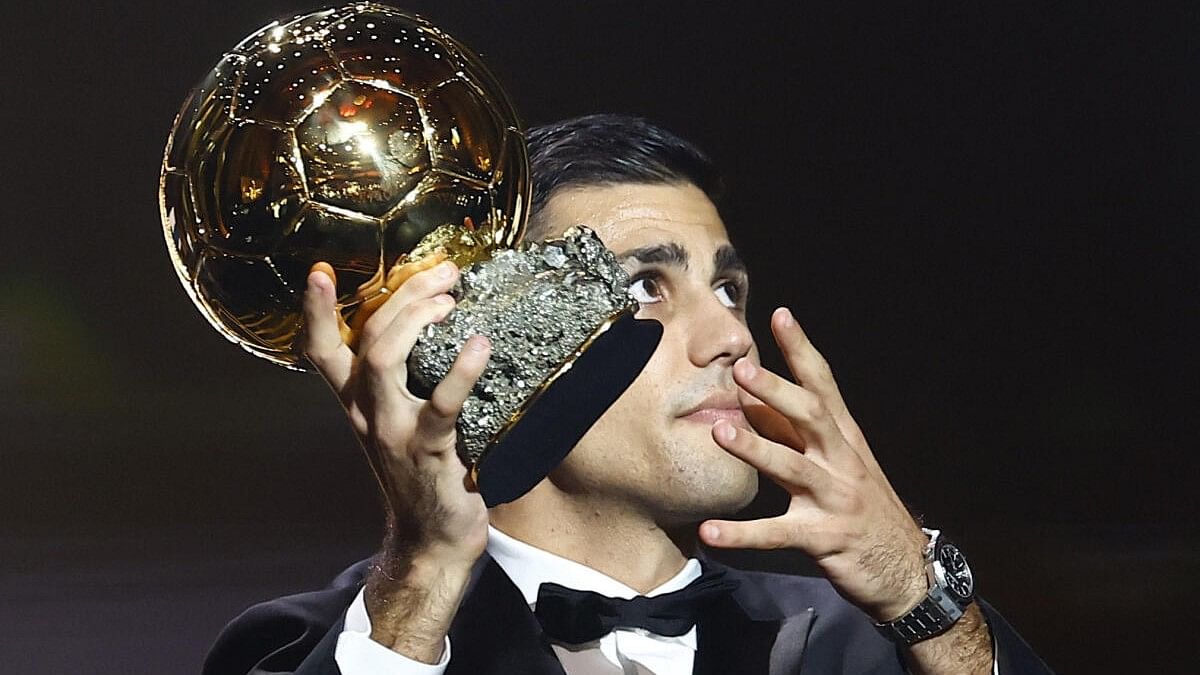 <div class="paragraphs"><p>Spain's and Manchester City's Rodri with the Ballon d'Or </p></div>