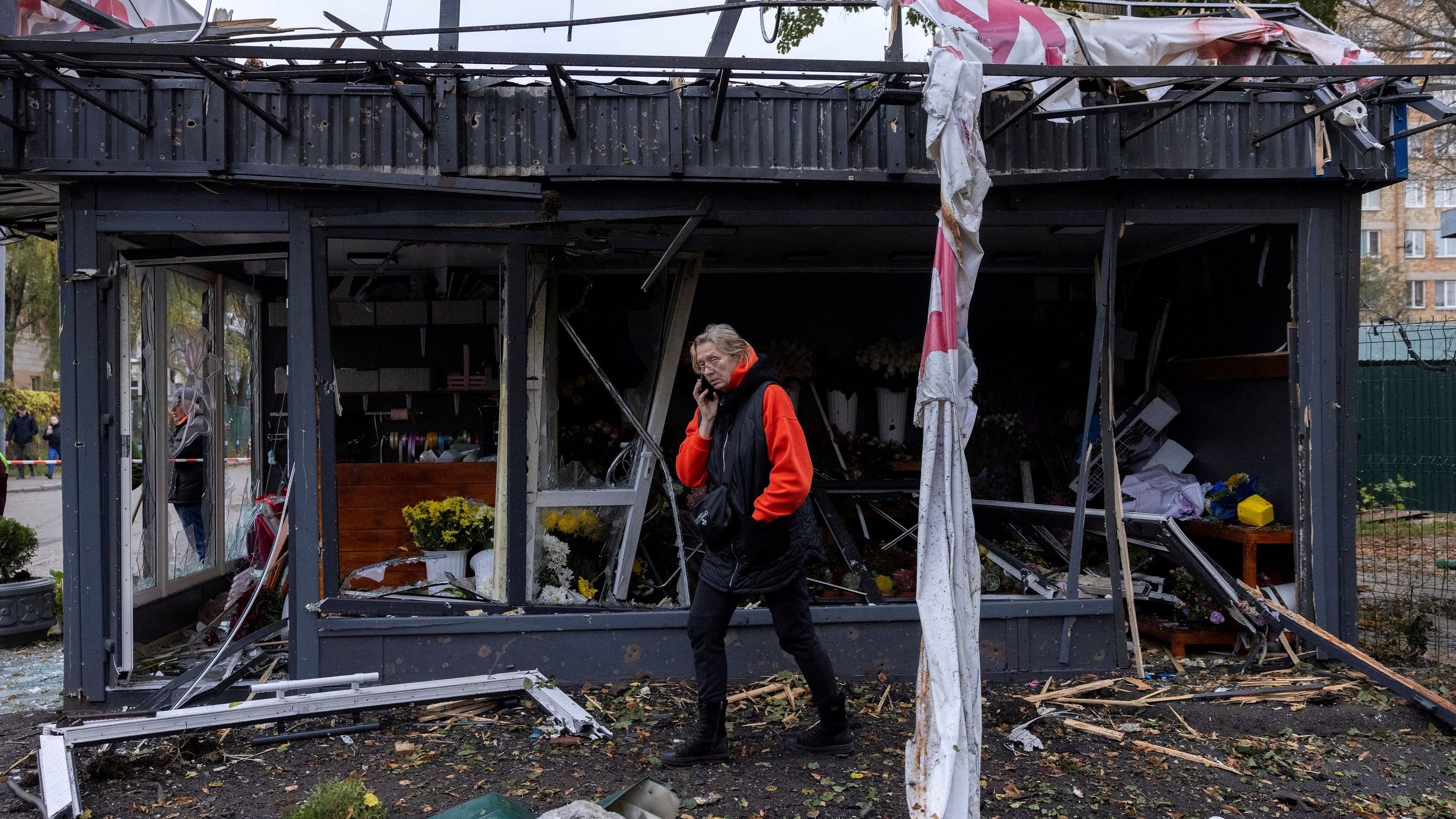 <div class="paragraphs"><p>A woman inspects the damage to a shop after a Russian drone strike, amid Russia's attack on Ukraine, in Kyiv, Ukraine October 29, 2024.  </p></div>