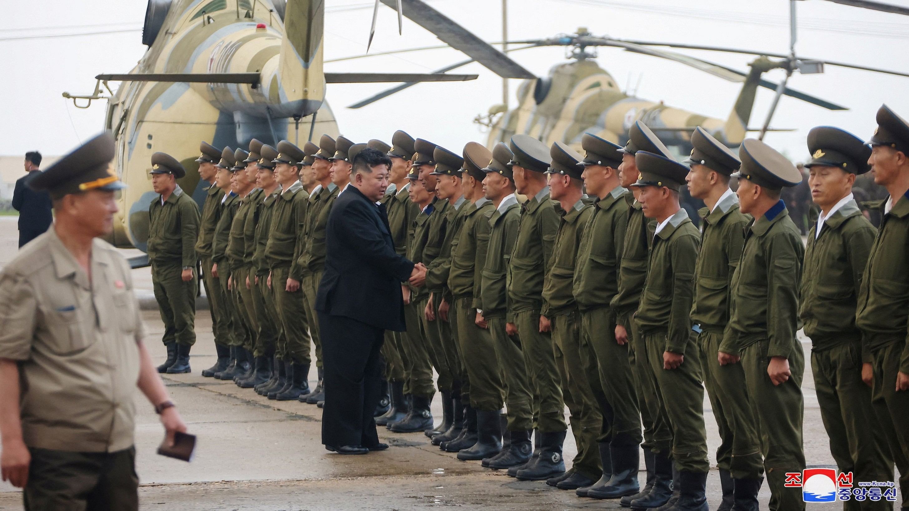 <div class="paragraphs"><p>North Korean leader Kim Jong Un greets military personnel.</p></div>