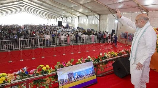 <div class="paragraphs"><p>Union Home Minister Amit Shah addresses during the inauguration of a passenger terminal and cargo gate, at Petrapole Border.</p></div>