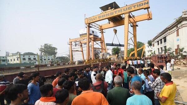 <div class="paragraphs"><p>People gather at Patna Metro tunnel construction site where three people died and many injured after they were buried under soil, at Patna Science College NIT more, in Patna.</p></div>