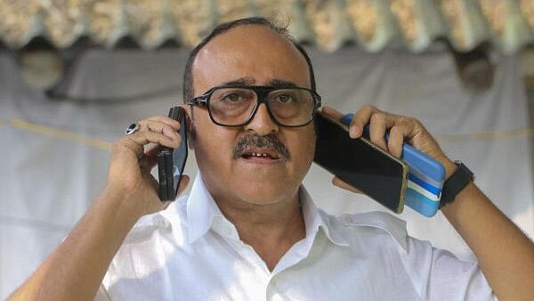 <div class="paragraphs"><p>Vanchit Bahujan Aghadi (VBA) candidate Anees Ahmed speaks on phone upon his arrival to file his nomination for Maharashtra Assembly elections, in Nagpur.</p></div>