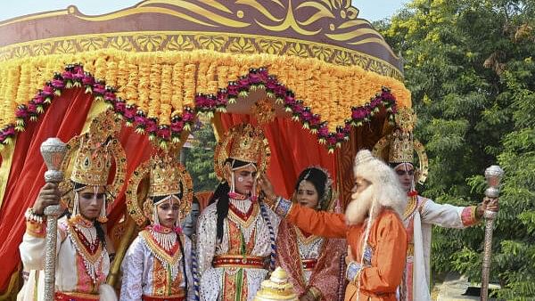 <div class="paragraphs"><p>Artists dressed as Lord Rama, Lakshman and Sita participate in a tableau ahead of Deepotsav celebrations, in Ayodhya</p></div>