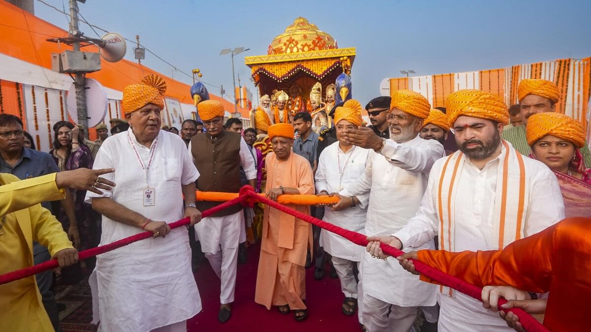 <div class="paragraphs"><p>Uttar Pradesh Chief Minister Yogi Adityanath and others pull a chariot carrying artists dressed as Lord Rama, Lord Lakshmana and Goddess Sita during Deepotsav celebrations.</p></div>