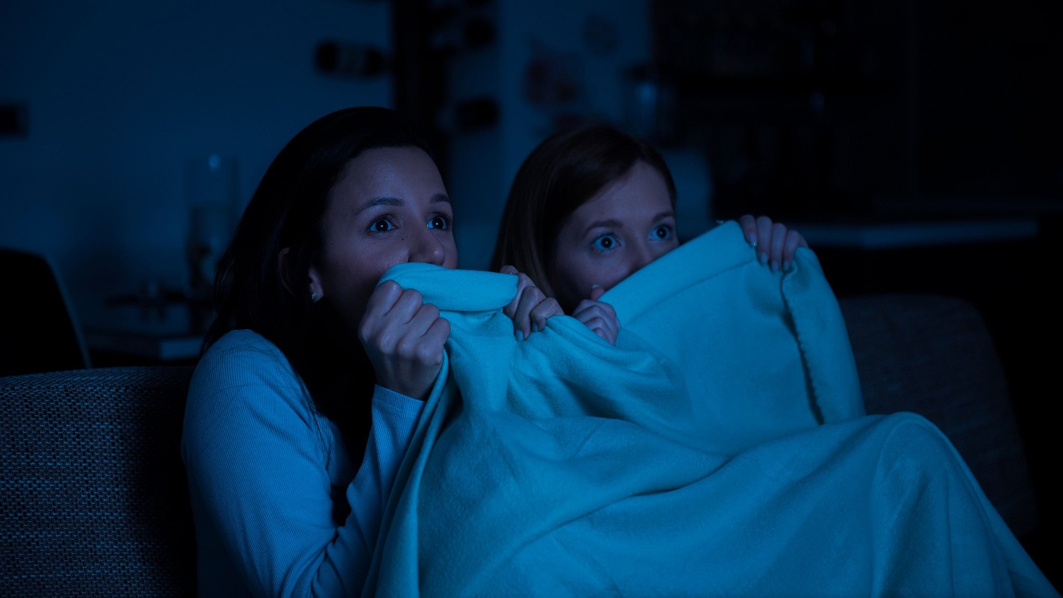 <div class="paragraphs"><p>Representative image showing two women watching a horror movie</p></div>