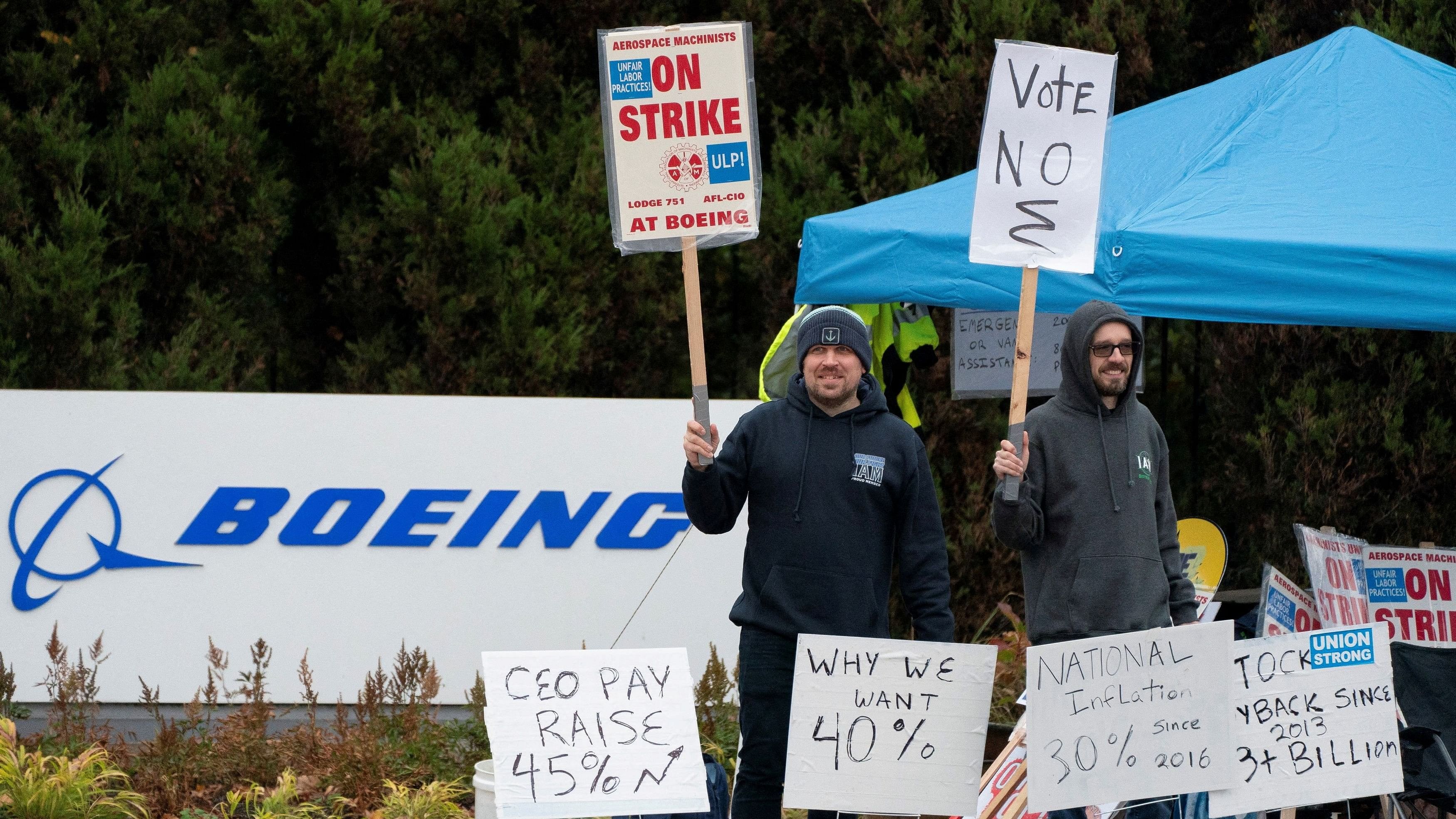 <div class="paragraphs"><p>FILE PHOTO: Boeing workers from the International Association of Machinists and Aerospace Workers District 751 gather on a picket line near the entrance to a Boeing production facility on the day of a vote on a new contract proposal during an ongoing strike in Renton, Washington.</p></div>