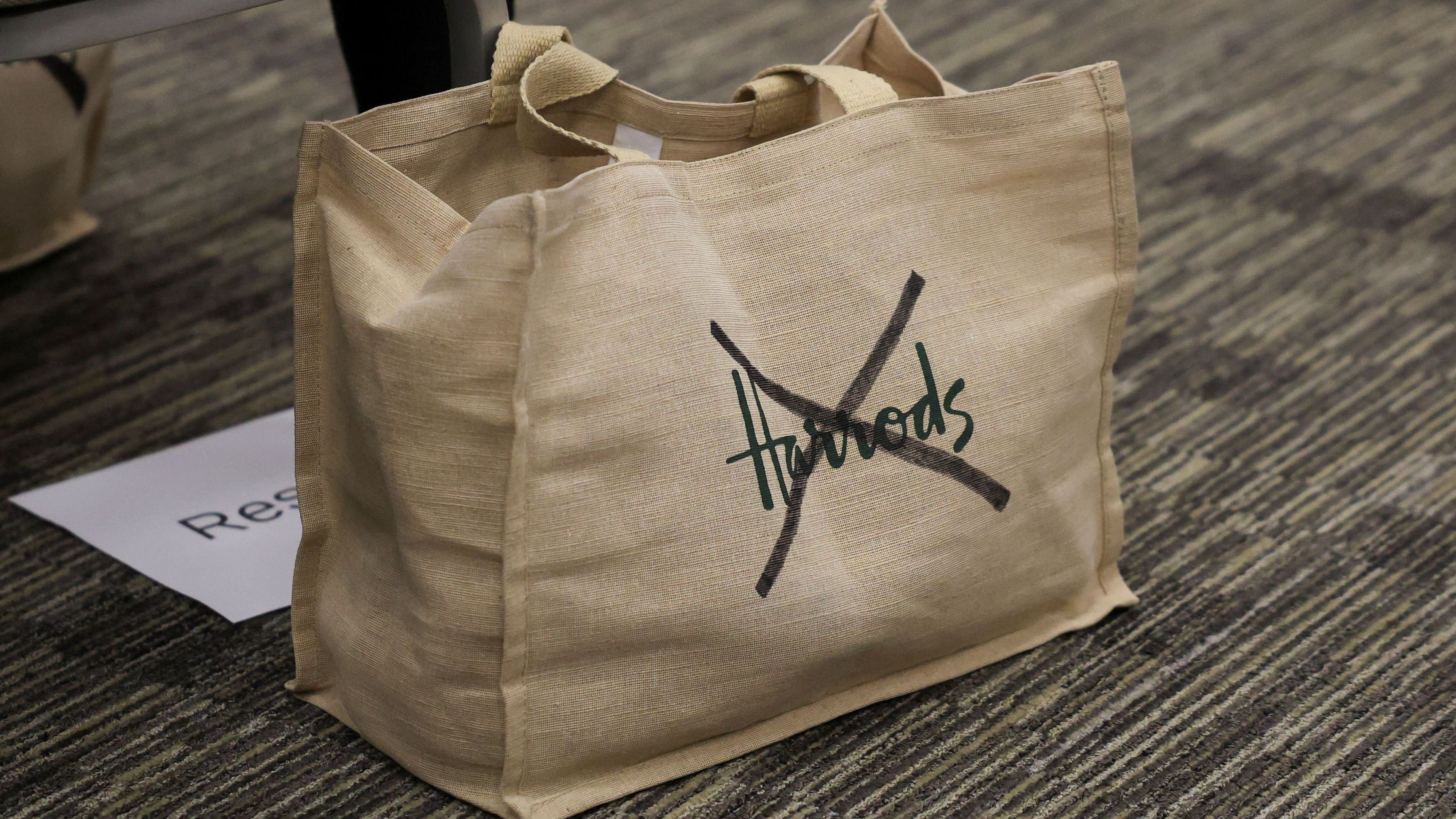 <div class="paragraphs"><p>A Harrods bag with a cross drawn over the logo, is seen during the Justice for Harrods Survivors press conference in London, Britain, October 31, 2024</p></div>