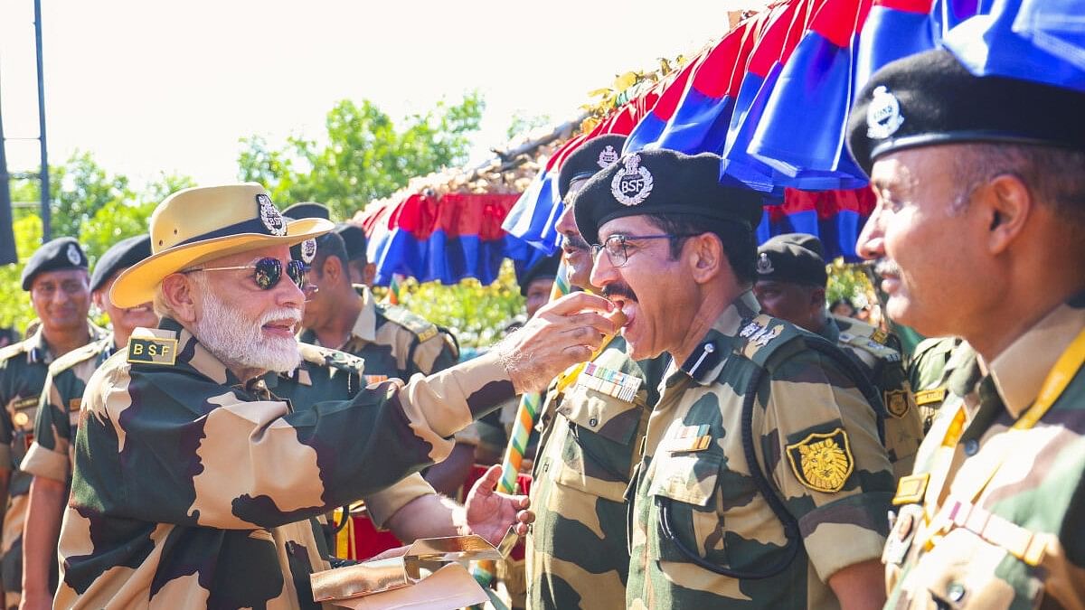 <div class="paragraphs"><p>Prime Minister Narendra Modi with BSF jawans during Diwali celebration at Lakki Nala in Sir Creek area in Kutch.</p></div>