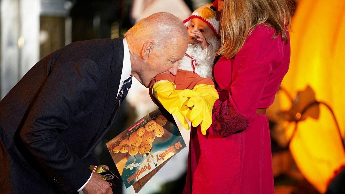 <div class="paragraphs"><p>U.S. President Joe Biden playfully bites a baby during a trick-or-treaters celebration for Halloween at the White House.</p></div>