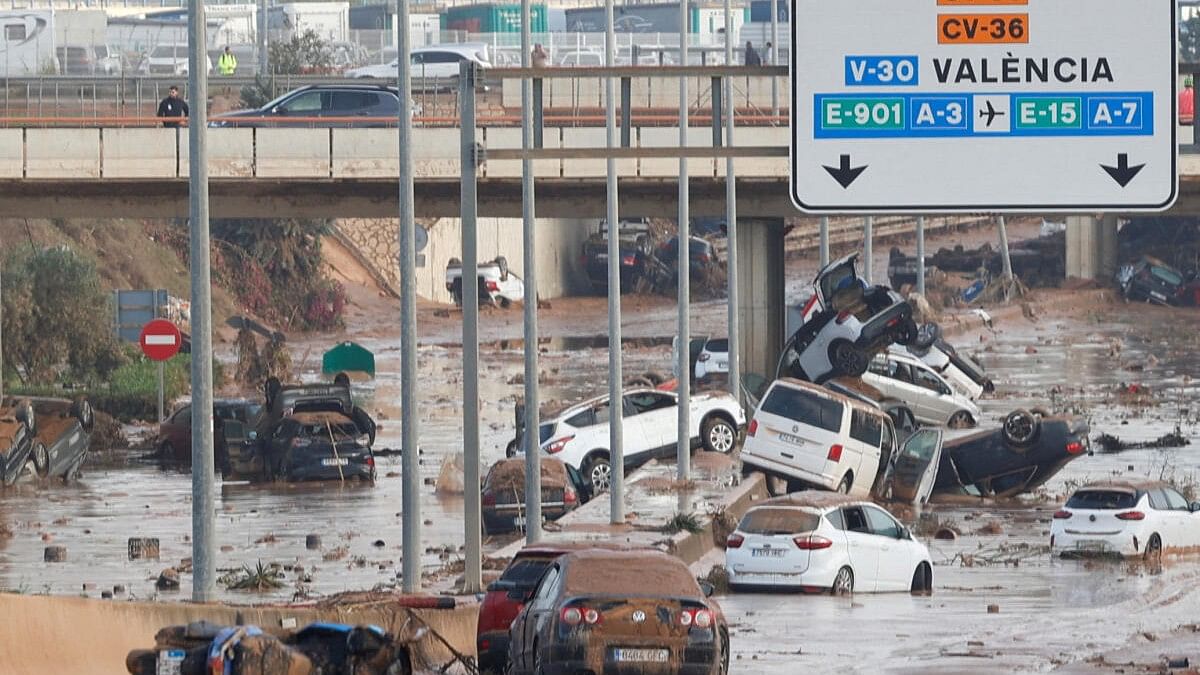 <div class="paragraphs"><p>Damaged cars are seen along a road affected by torrential rains that caused flooding, on the outskirts of Valencia, Spain, October 31, 2024.</p></div>