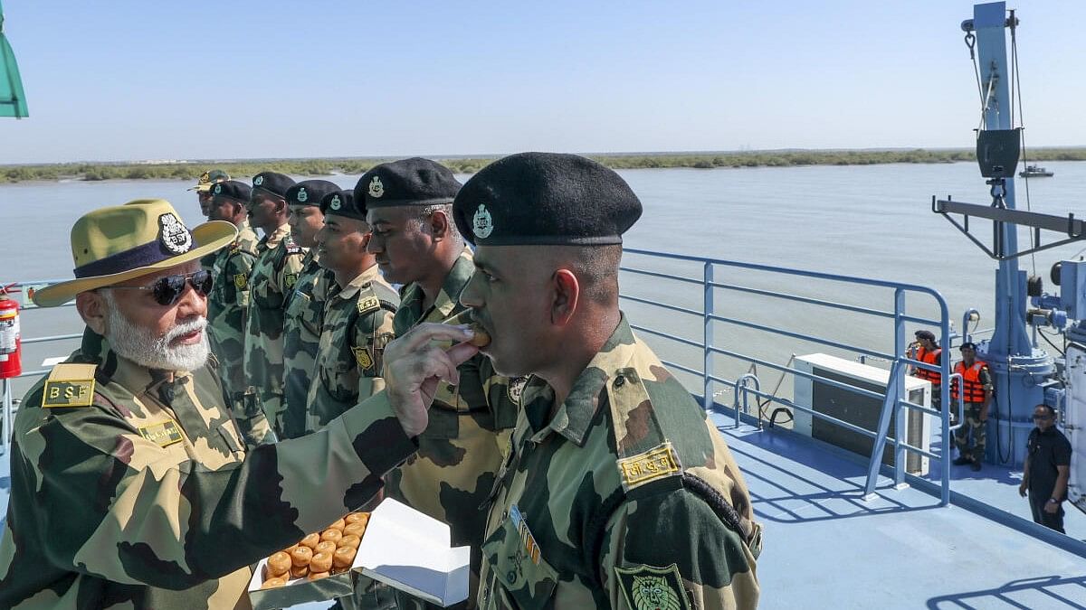 <div class="paragraphs"><p>Prime Minister Narendra Modi on the floating border outposts (BOPs) during Diwali celebration with BSF personnel at Lakki Nala in Sir Creek area in Kutch.</p></div>