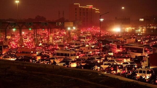 <div class="paragraphs"><p>Traffic jam on Delhi-Gurugram expressway at the border near Sirhaul Toll Plaza on the eve of the ‘Diwali’ festival, in Gurugram.</p></div>