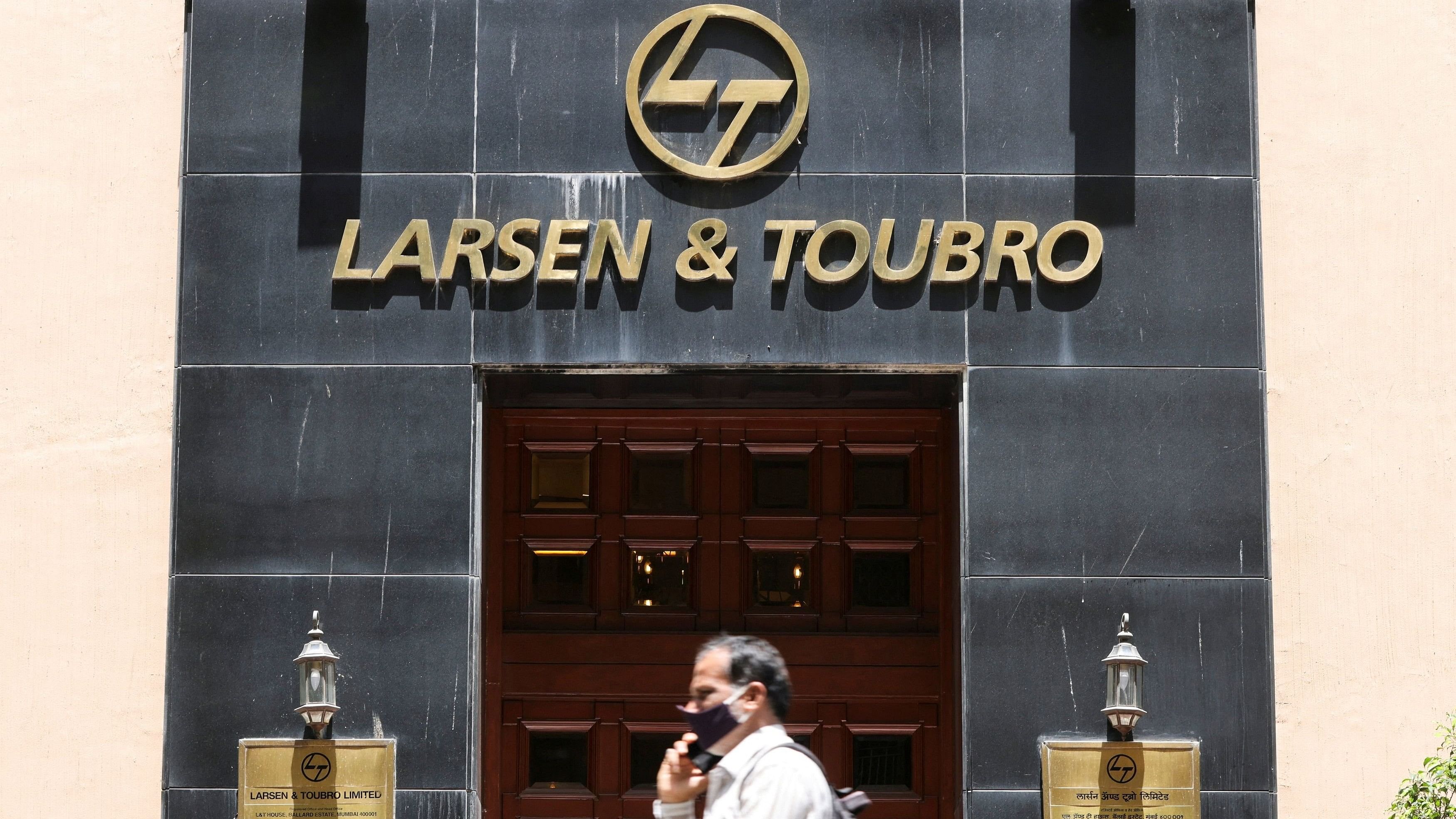 <div class="paragraphs"><p>A man walks past the Larsen and Toubro  head office in Mumbai.</p></div>