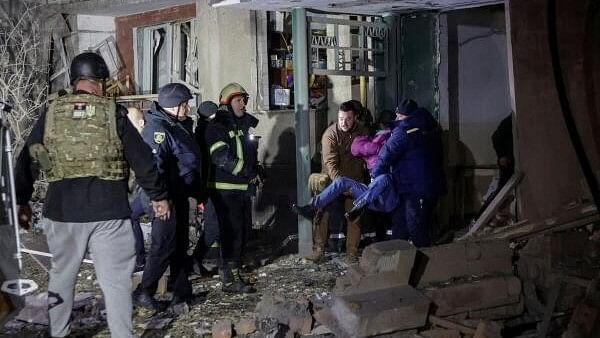 <div class="paragraphs"><p>Rescuers and medical workers carry a survivor at the site of an apartment building hit by a Russian air strike, amid Russia's attack on Ukraine, in Kharkiv, Ukraine October 31, 2024. </p></div>