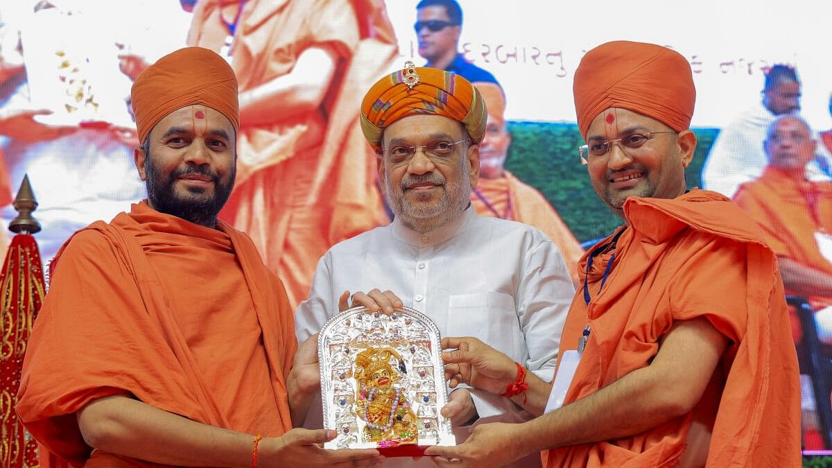 <div class="paragraphs"><p>Union Home Minister Amit Shah during the inauguration of 'Gopalanand Swami Yatrik Bhavan' at the Lord Hanuman temple, in Salangpur village of Botad district, Gujarat.</p></div>