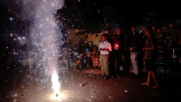 <div class="paragraphs"><p>People light fireworks to celebrate Diwali, the Hindu festival of lights, in New Delhi, India, October 31, 2024. </p></div>