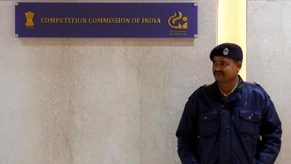 <div class="paragraphs"><p>A security guard stands outside the Competition Commission of India (CCI) headquarters in New Delhi</p></div>