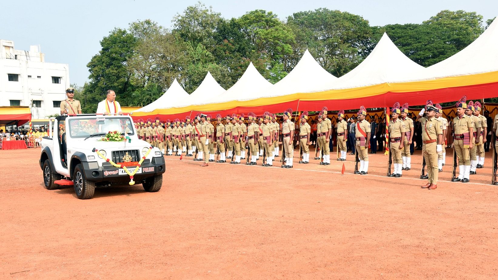 <div class="paragraphs"><p>District-in-charge Minister and Minister for Health and Family Welfare Dinesh Gundu Rao receives the guard of honour during the Karnataka Rajyotsava celebrations held at Nehru Maidan in Mangaluru on Friday. </p></div>